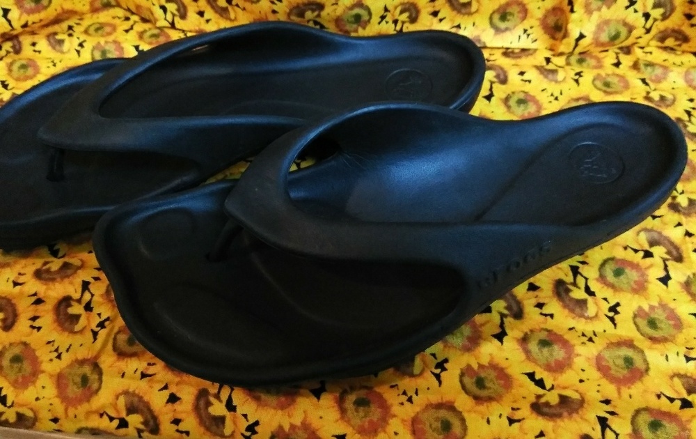 Women's black Crocs flip flops size 9